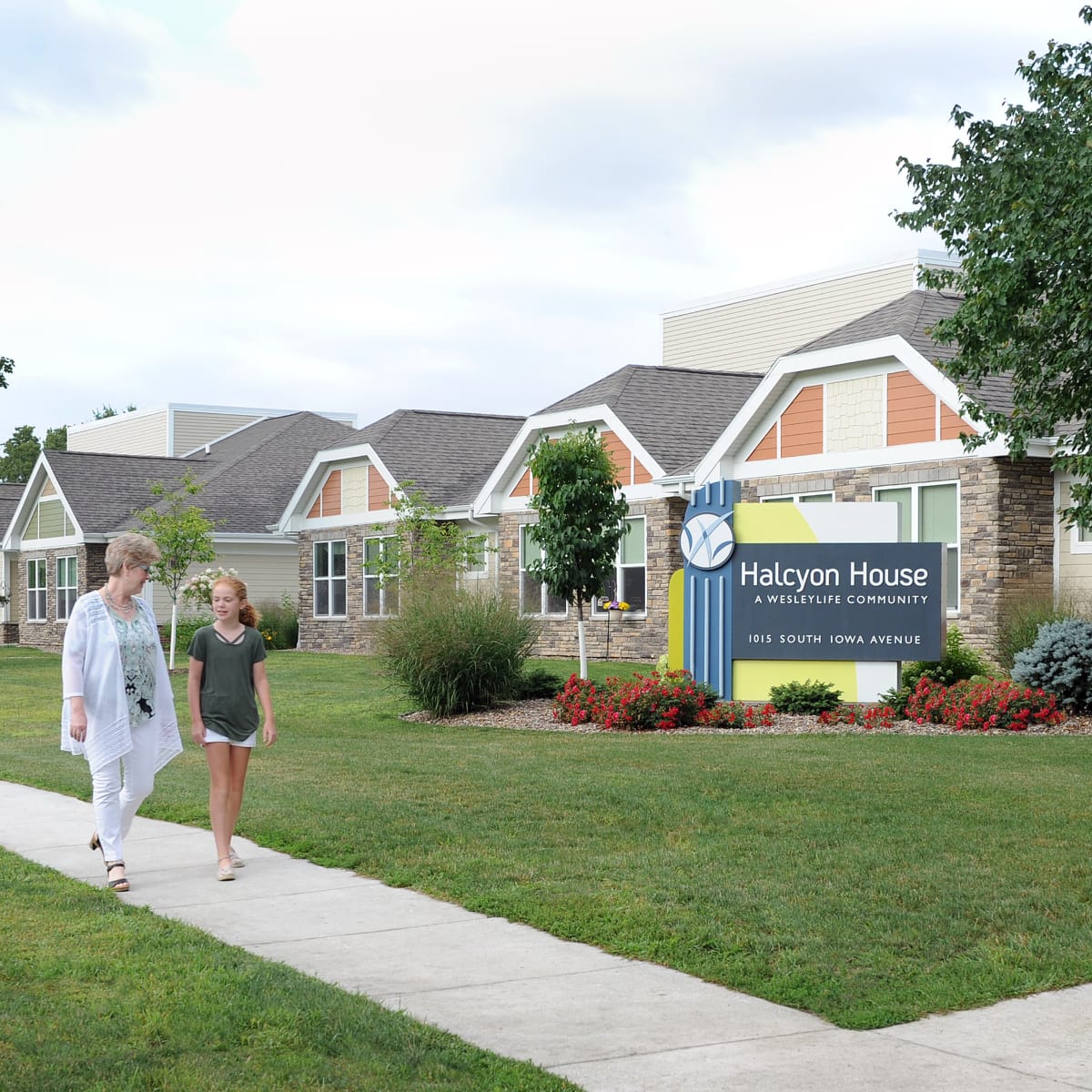 Main Sign with resident and her grandchild