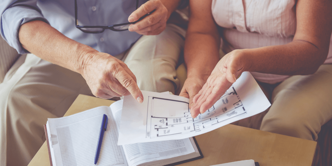 couple looking at floor plans