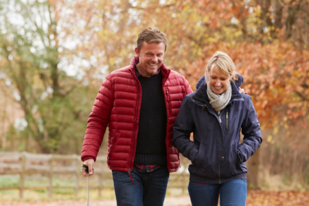 Senior woman and man walking outside