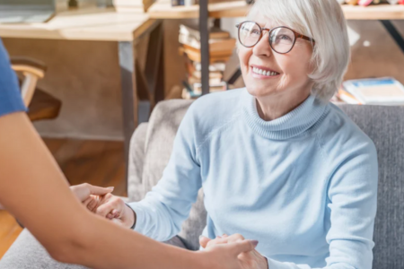 Senior woman smiling at caretaker