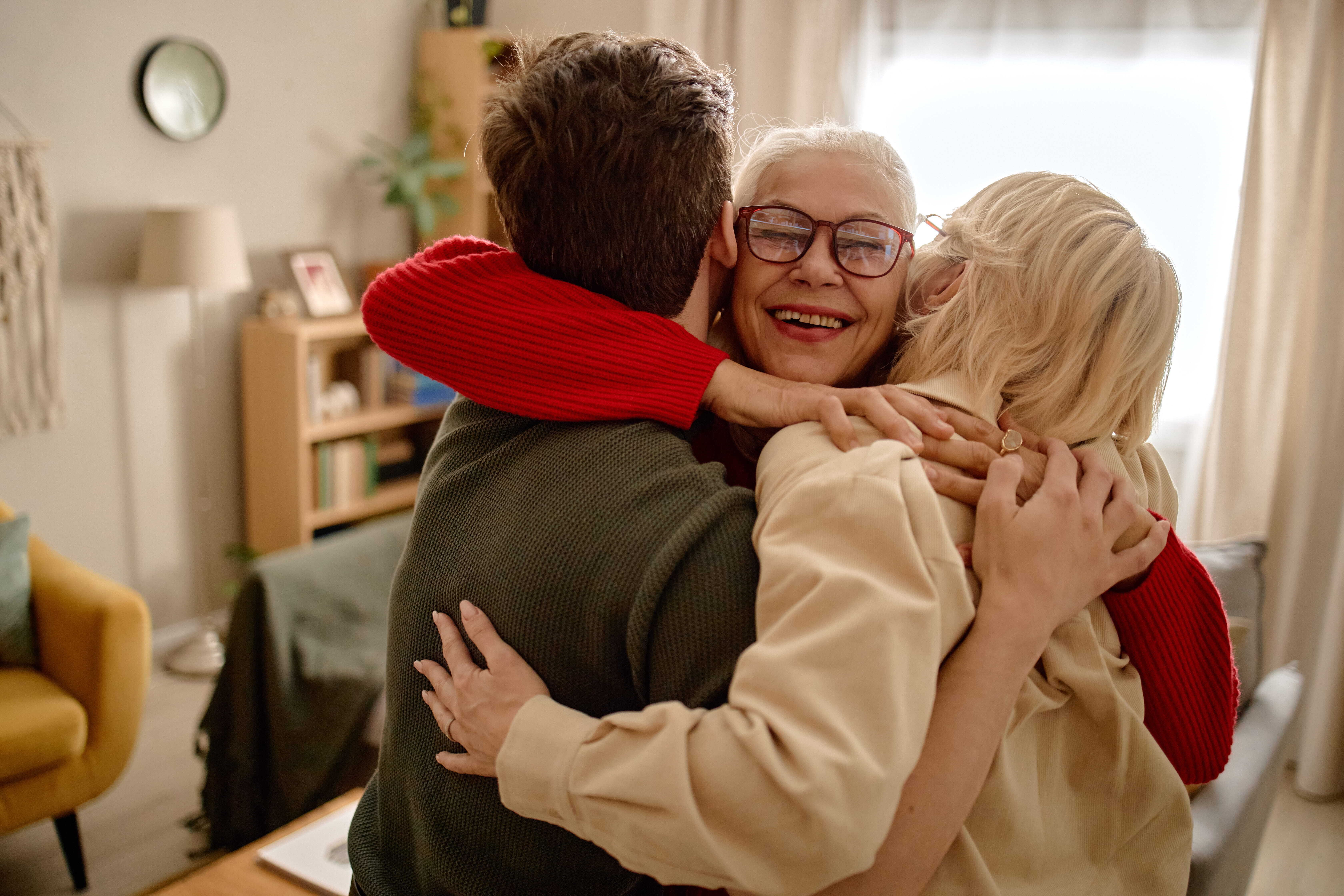 Senior woman smiling at camera and expressing family bonding