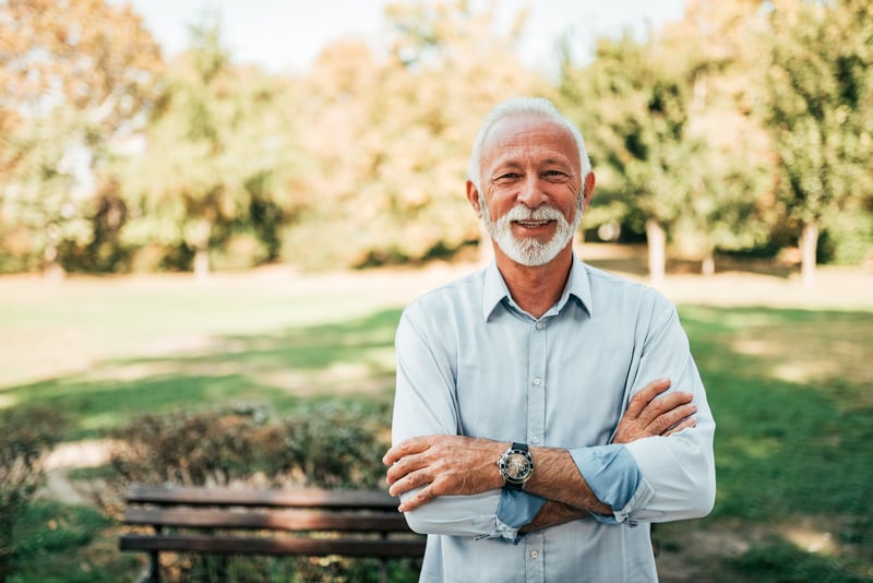 Senior Man Smiling At A Park