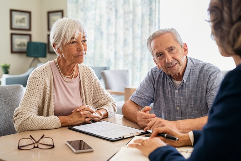 Senior couple planning their investments with financial advisor