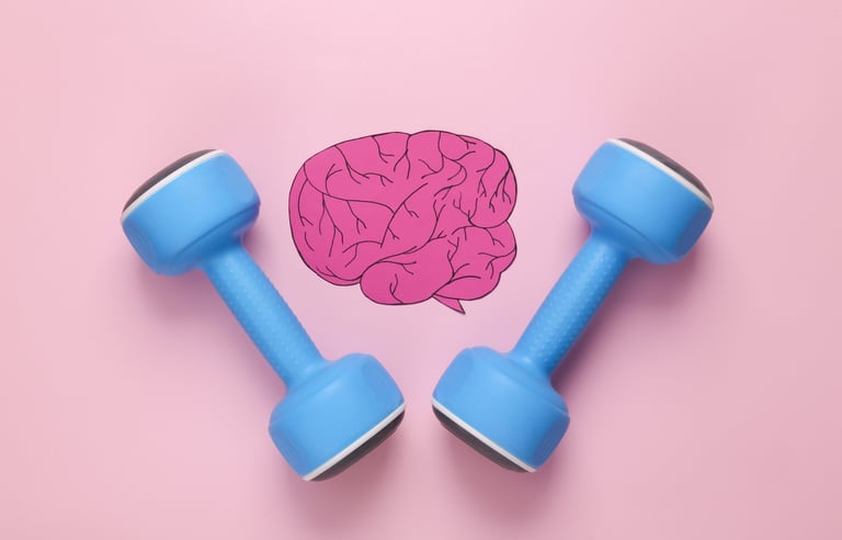 Small blue weights next to a drawn graphic of a brain on a pink background.