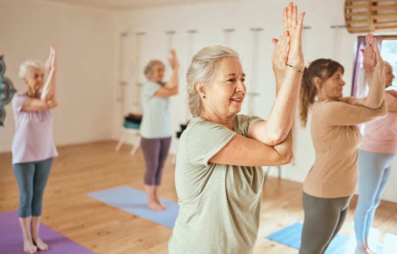 Seniors doing yoga together