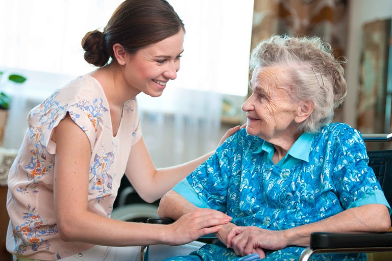 A senior woman with her home caregiver