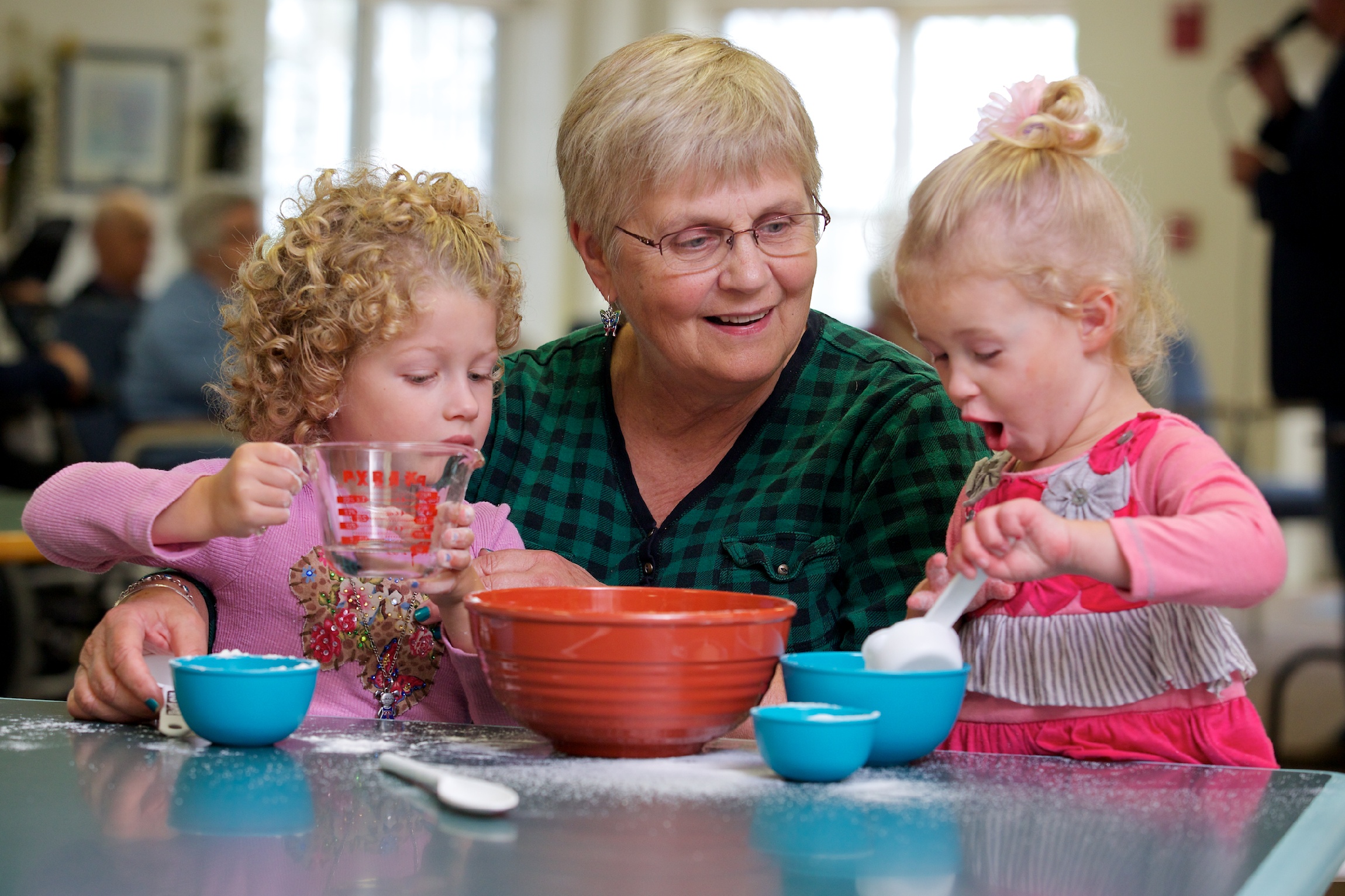 Adult day participant with children baking-1