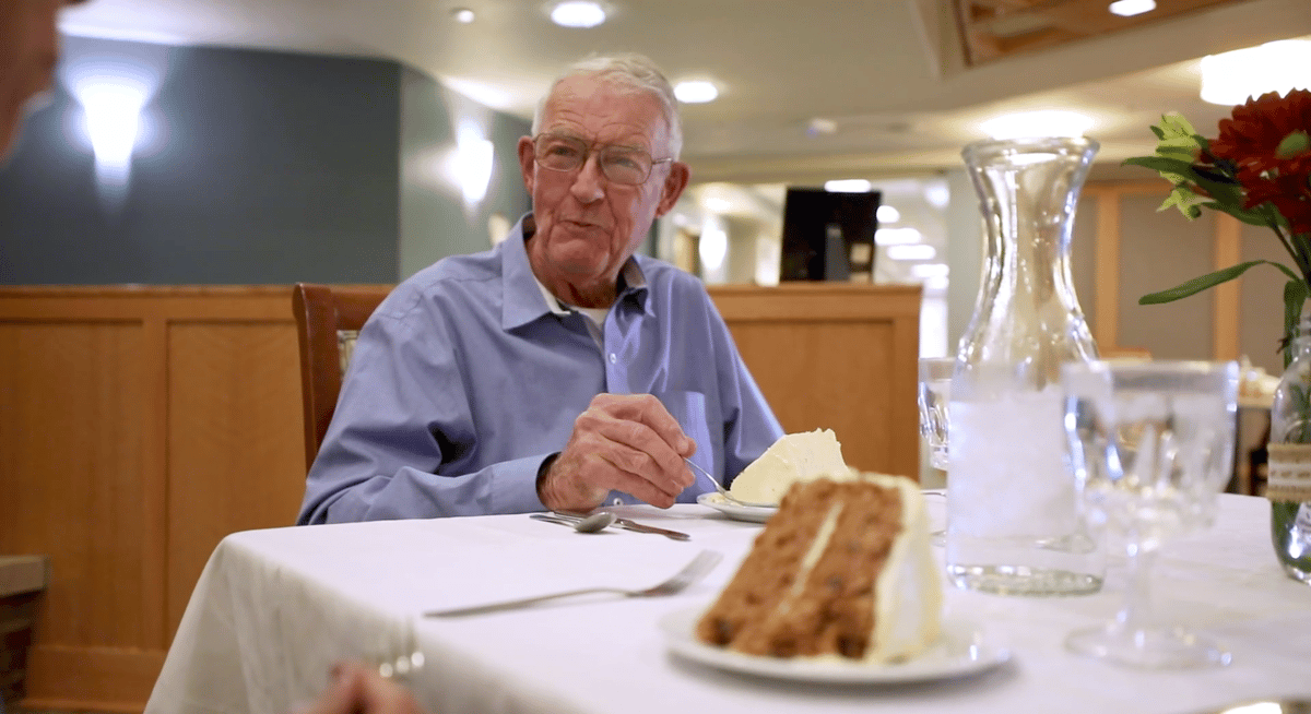 Senior man eating dessert