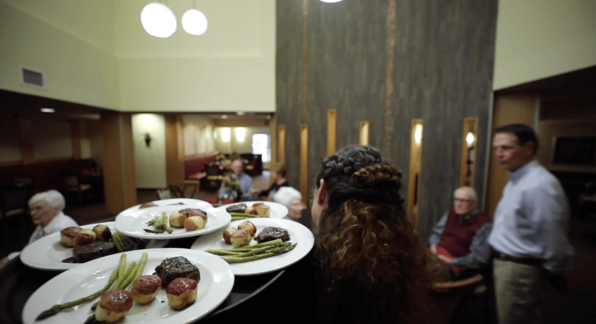 Waitress serving food