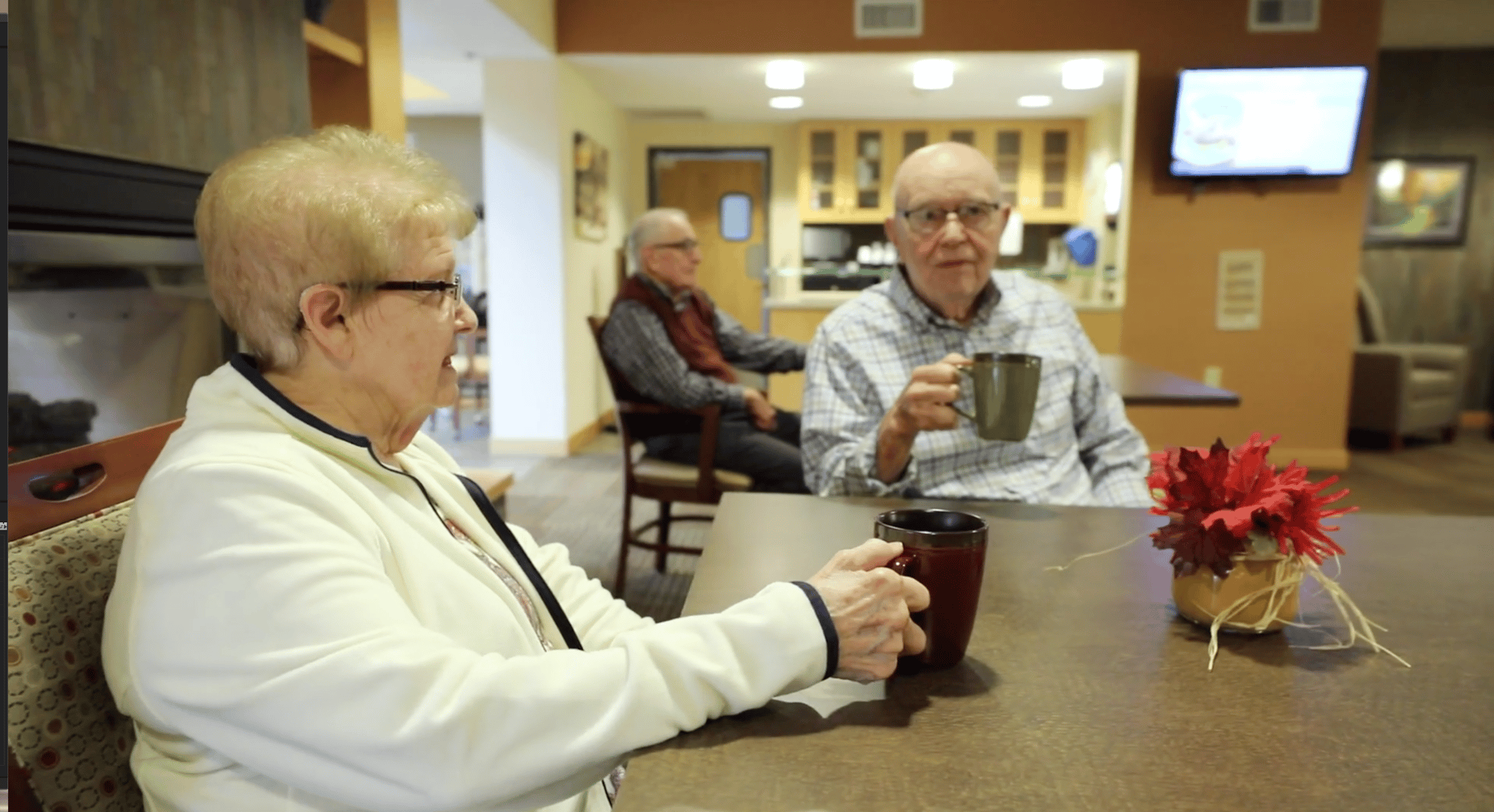 Senior friends drinking at the cafeteria