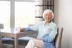 woman smiling with her coffee