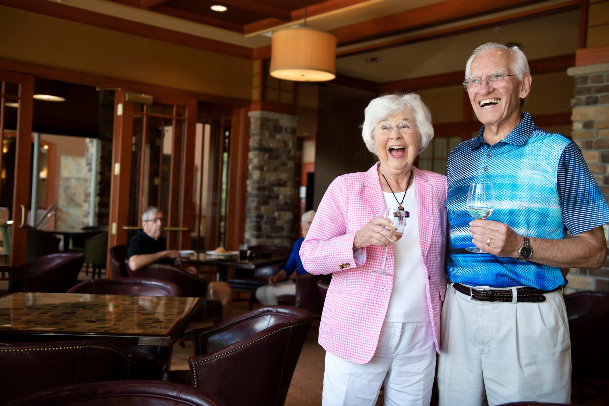 man and woman laughing in restaurant