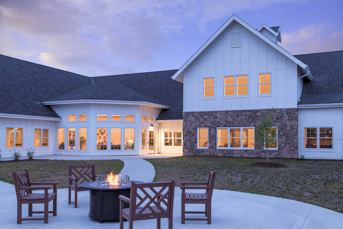 A modern outdoor firepit in a courtyard