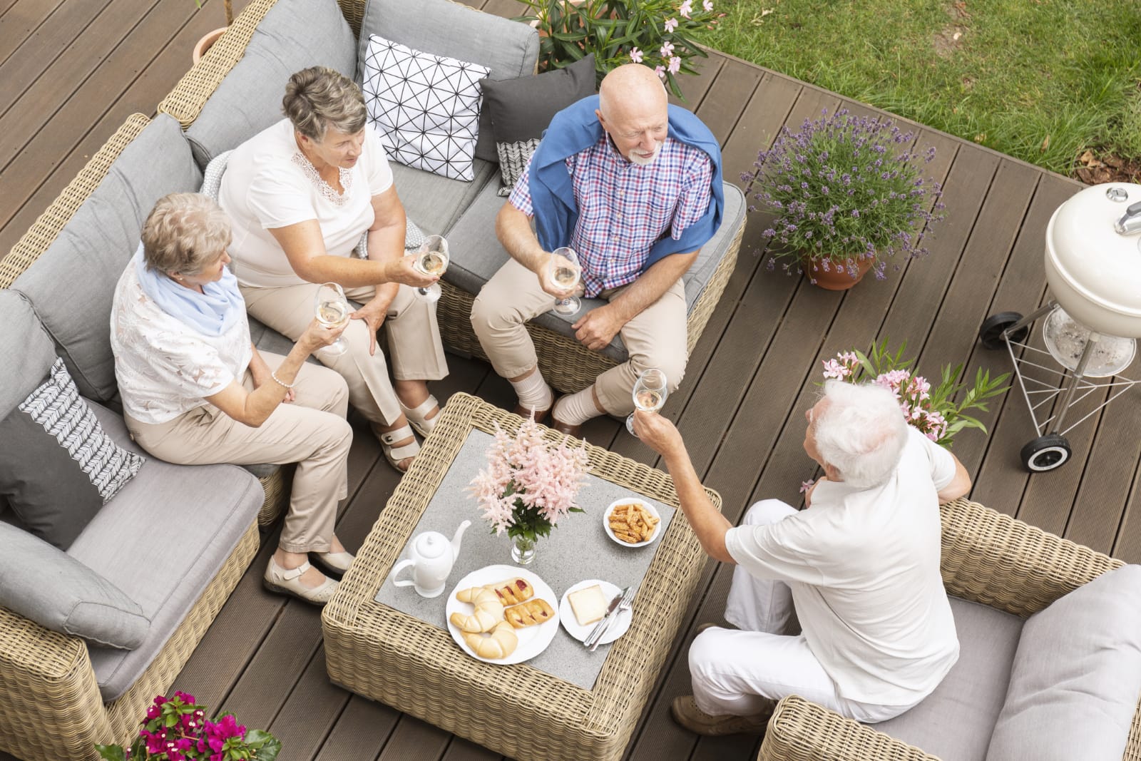 overhead shot of four seniors being social