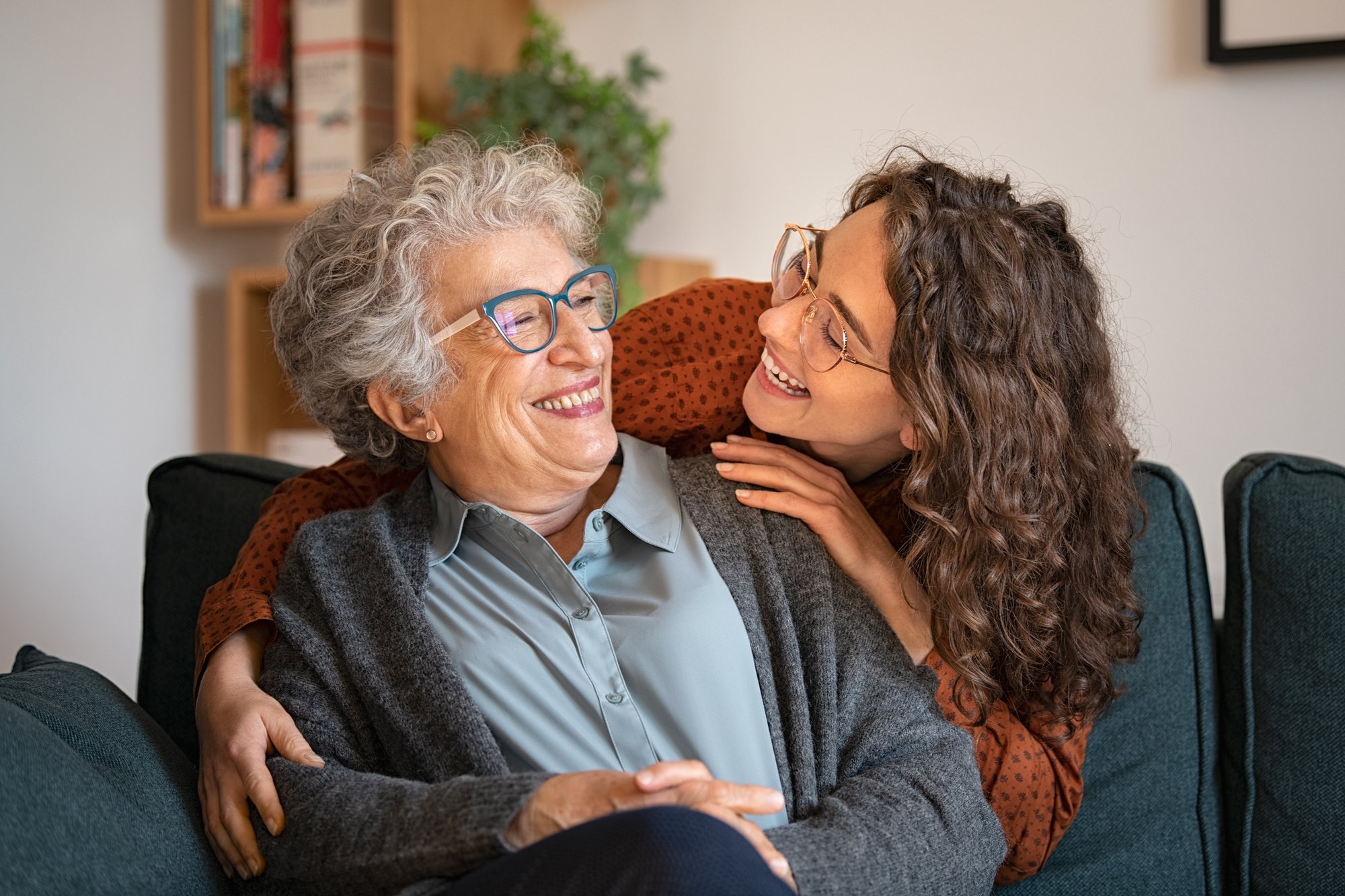 caregiver and senior woman smiling