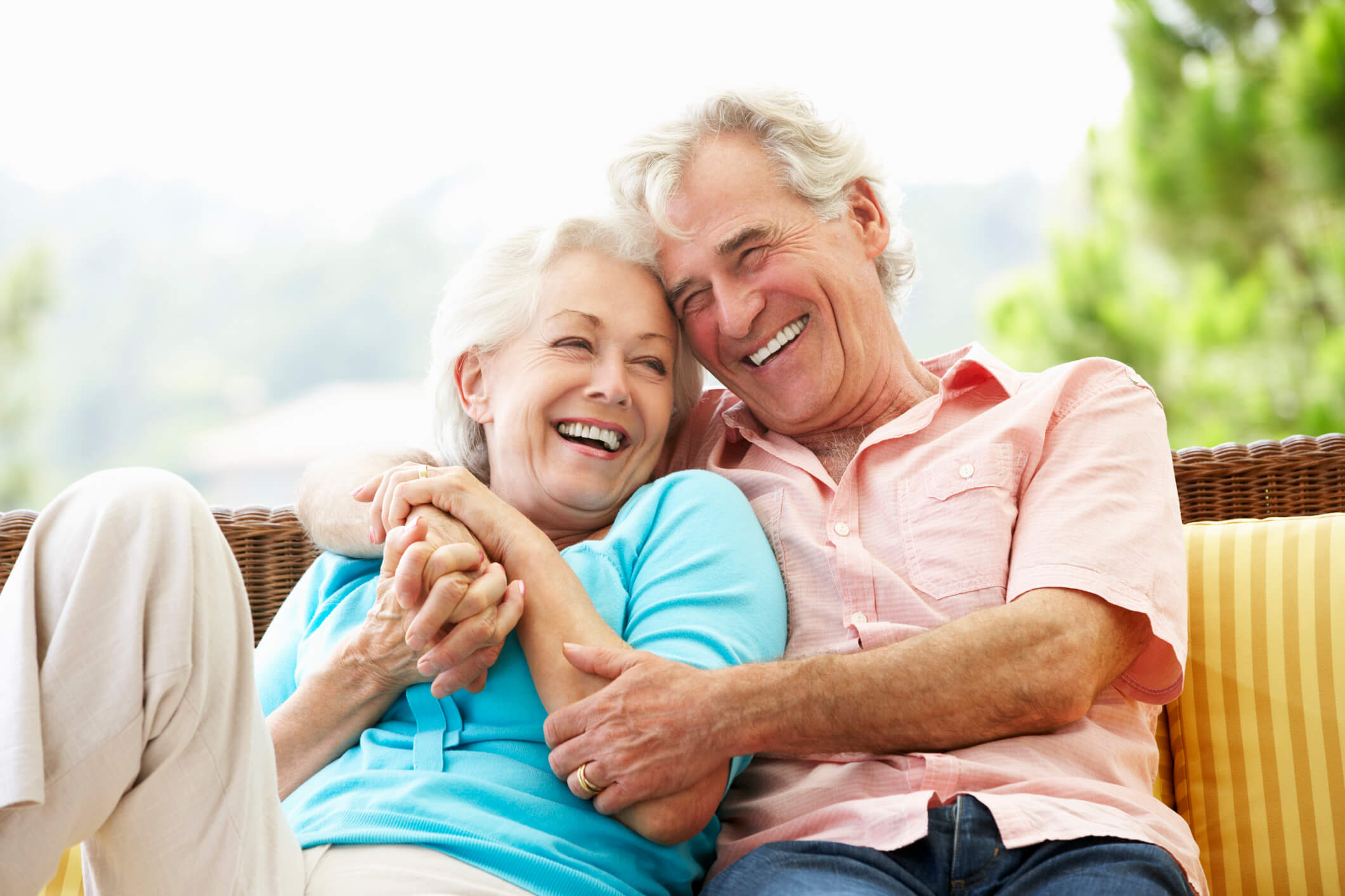 couple laughing and hugging