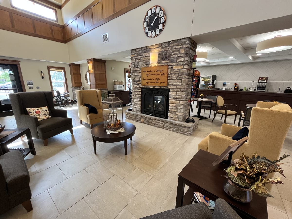 hearthstone living room with chairs and fireplace