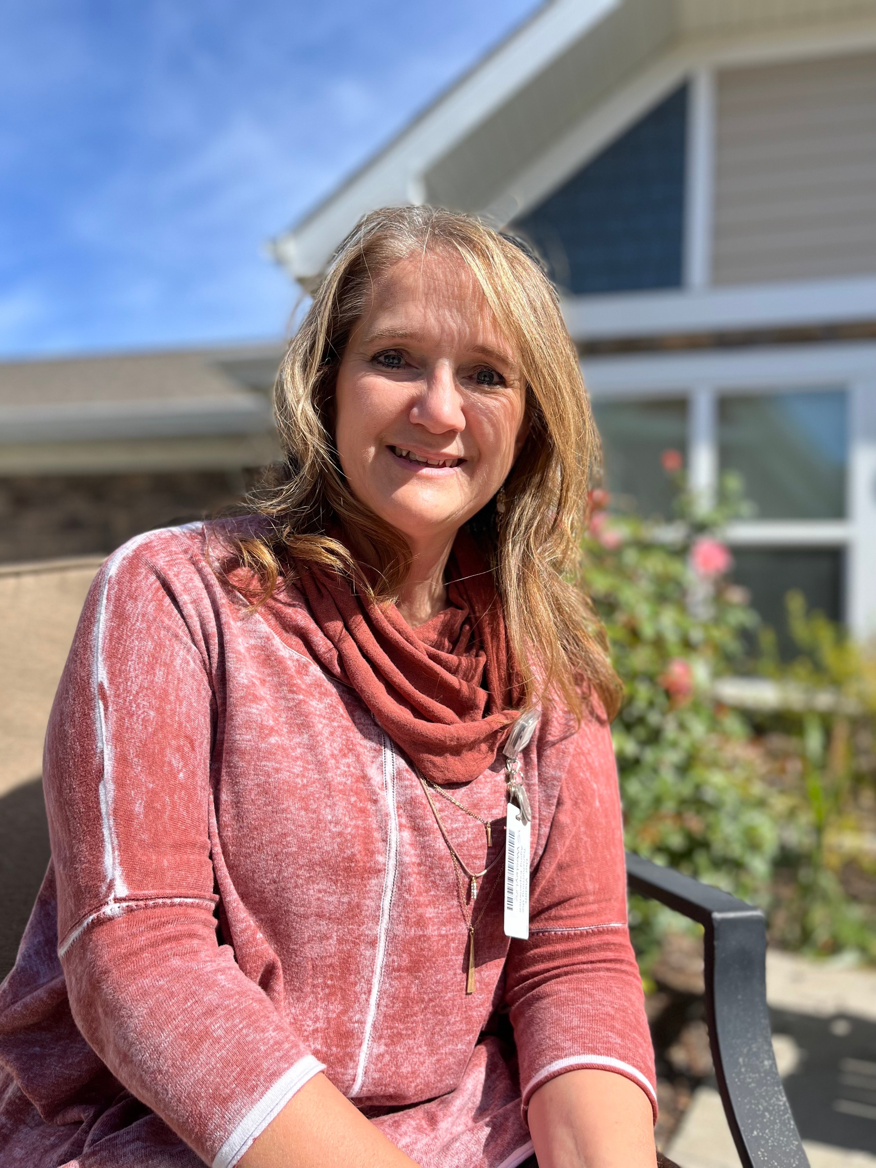 Nancy Hamilton sitting outside and smiling 