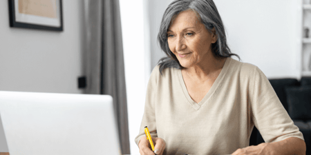 Senior woman viewing senior cost on laptop