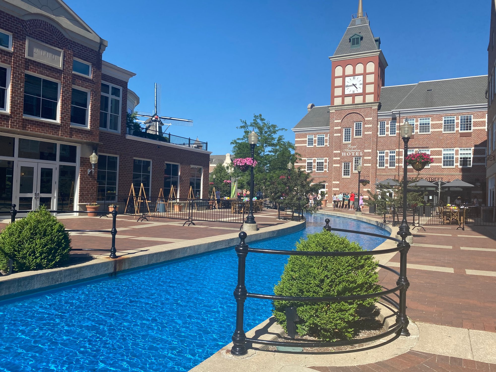 A pool in a coutyard between buildings