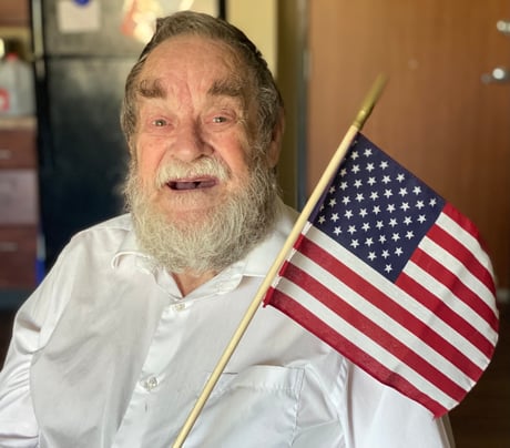 senior veteran with an American flag