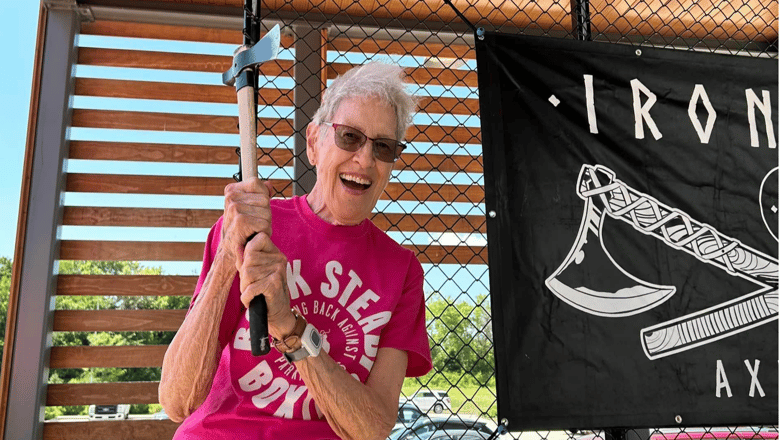 A person participating in an axe-throwing event