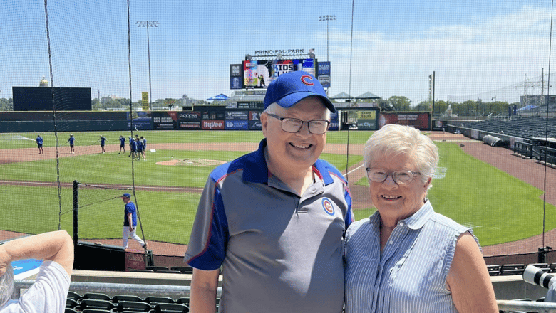 A couple at a baseball game