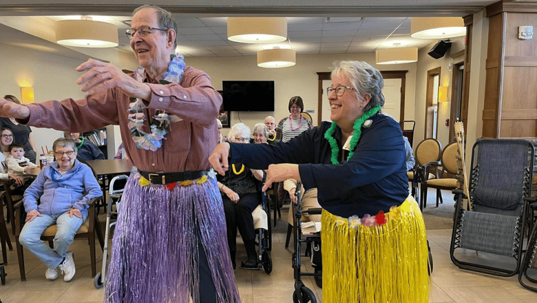 A group participating in a Hula dance class