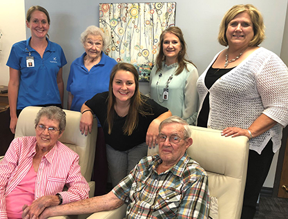 residents smiling with employees