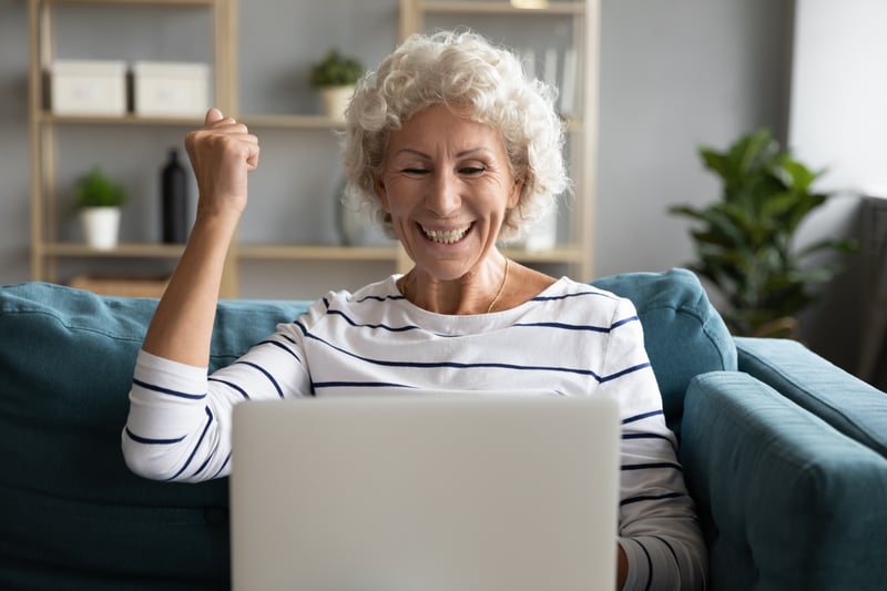 Senior Citizen excited on a laptop