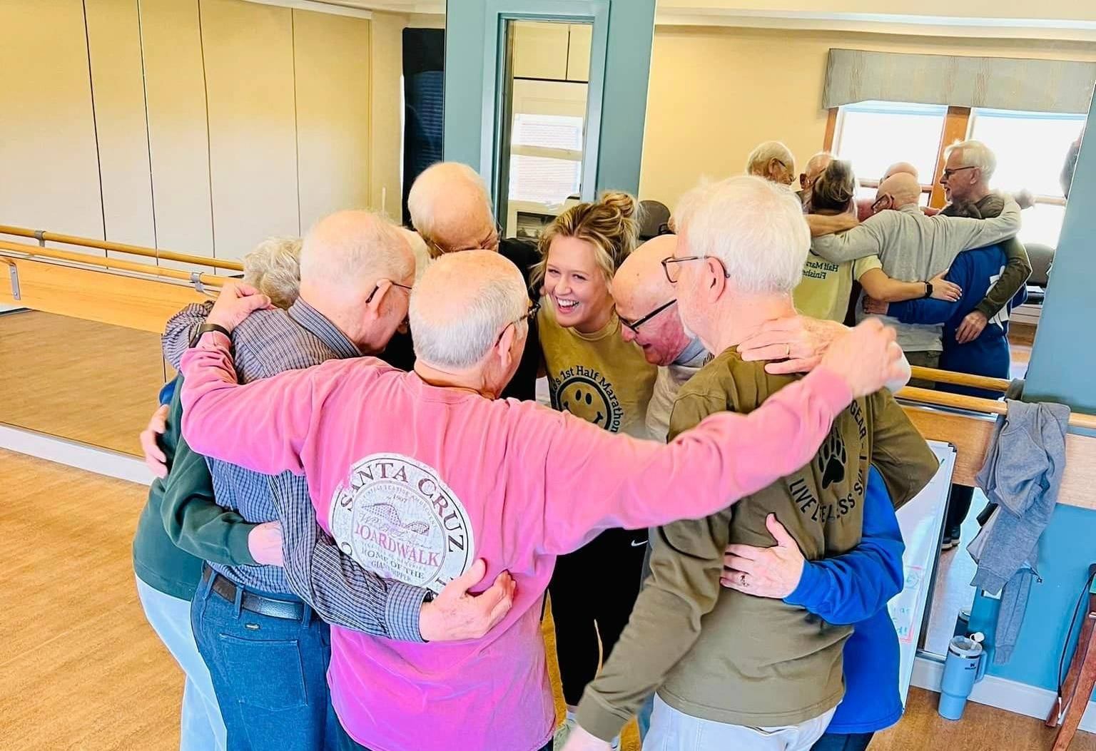 residents hugging instructor