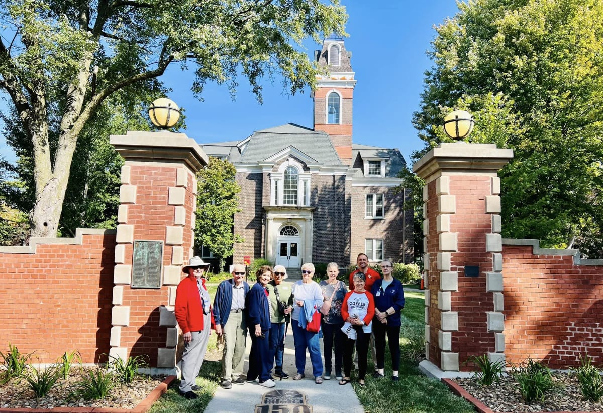 residents smiling in front of building