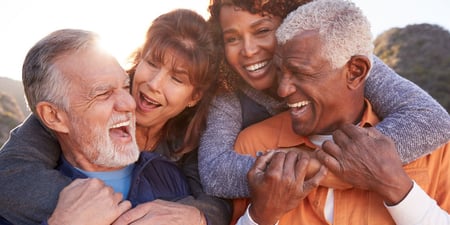 Senior couples smiling and laughing together
