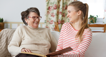 mother and daughter reading a book