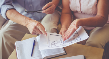 A senior couple planning when to move from assisted living to memory care