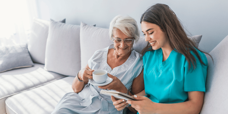 older adult woman receiving at-home senior care services