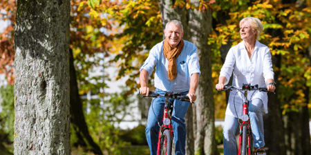 senior couple biking