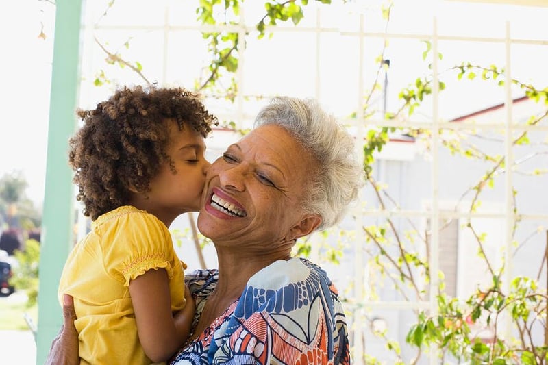 senior woman in independent living with grandchild