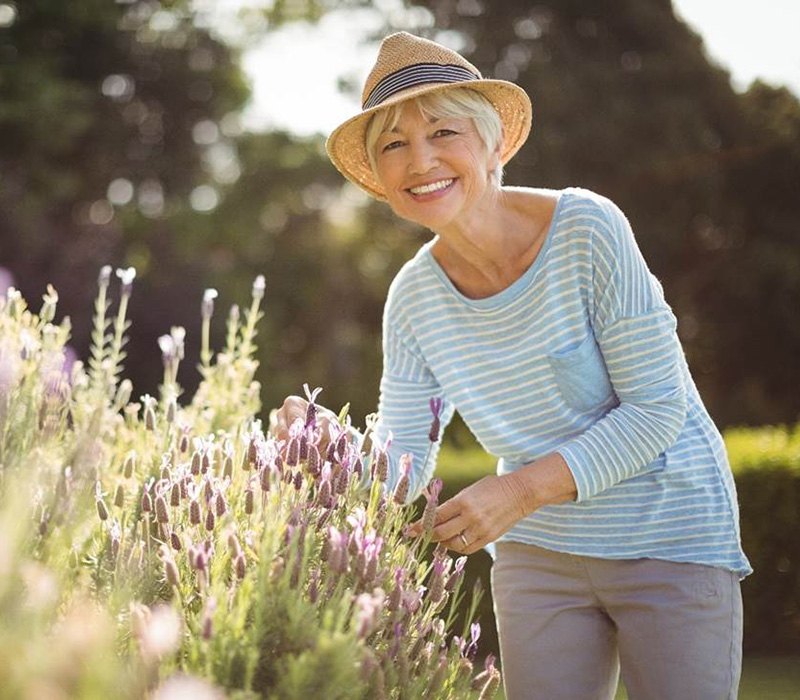 Senior women smiling while gardening