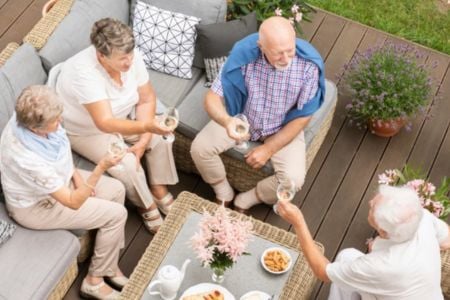 Seniors gathered around drinking coffee