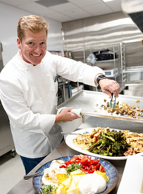 chef preparing meal in kitchen