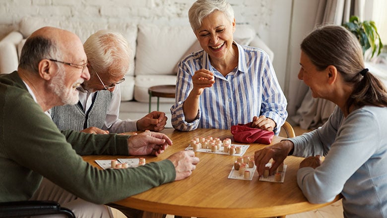 Group of four cheerful senior people, two men and two women