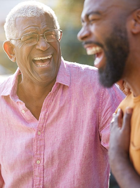 Two senior man laughing with each other