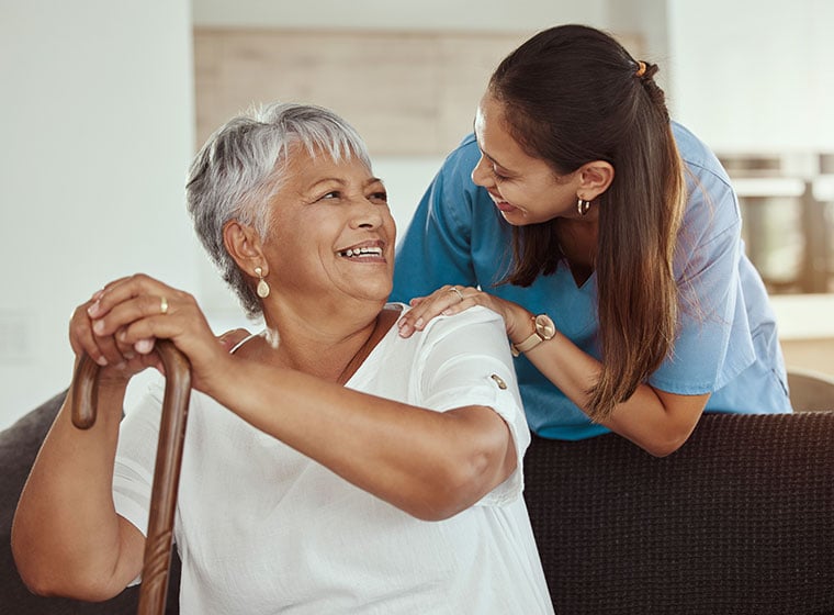 A senior woman with her caregiver