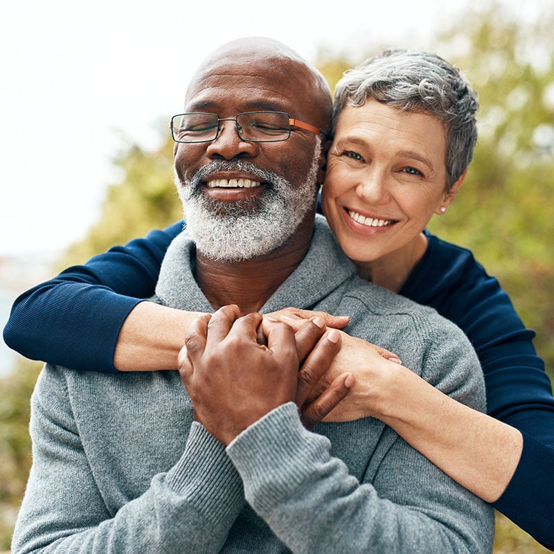 happy senior couple enjoying quality time at the park