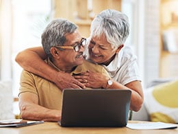 senior-couple-and-hug-at-table-in-home