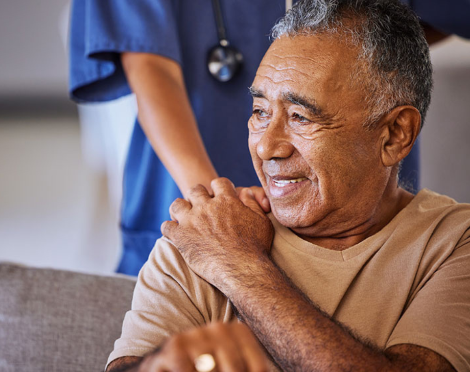 senior-man-holding-the-hand-of-a-caregiver2