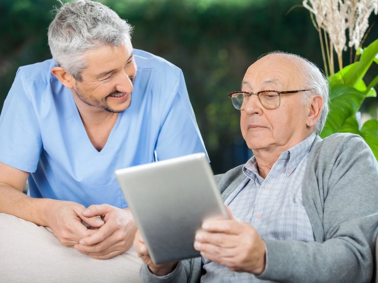 Senior man using an iPad. 