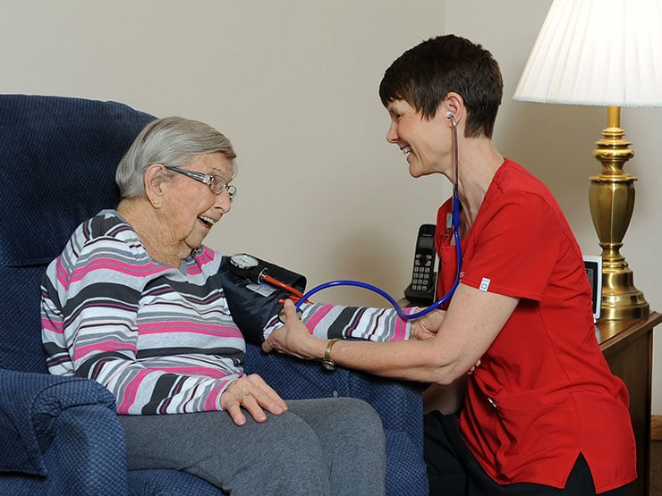 A senior woman getting medical assistance