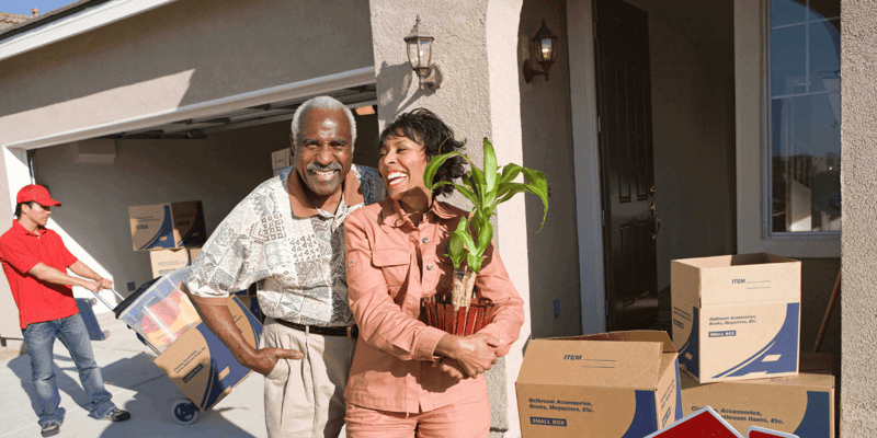 happy senior couple preparing to move to independent living